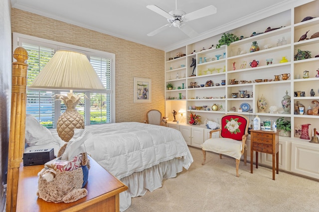 bedroom featuring a ceiling fan, crown molding, wallpapered walls, and carpet
