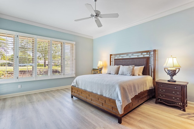 bedroom with ceiling fan, baseboards, crown molding, and light wood-type flooring