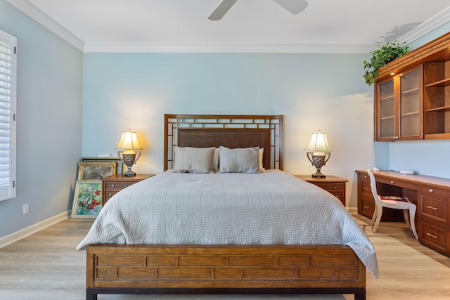 bedroom with light wood-type flooring, baseboards, and ornamental molding