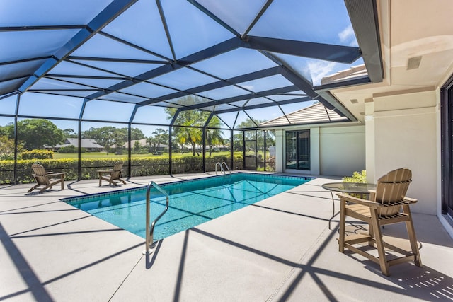 pool with a lanai and a patio