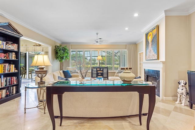 living room featuring a high end fireplace, ornamental molding, recessed lighting, and ceiling fan