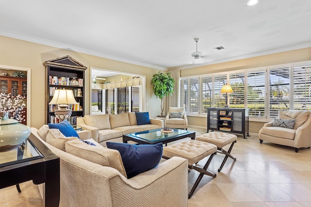 living room with light tile patterned flooring, baseboards, visible vents, a ceiling fan, and ornamental molding