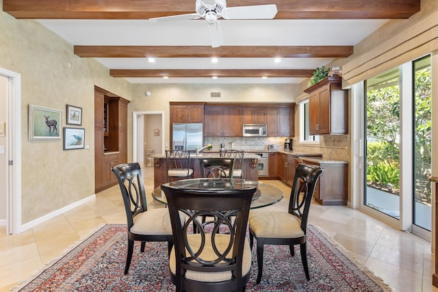 dining area with beamed ceiling, baseboards, ceiling fan, and light tile patterned floors