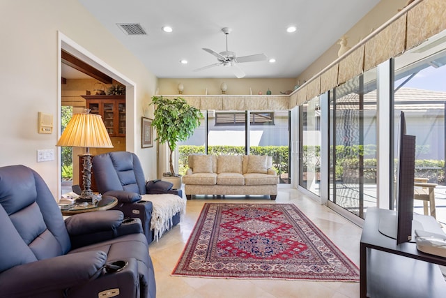 living room featuring ceiling fan, visible vents, and recessed lighting