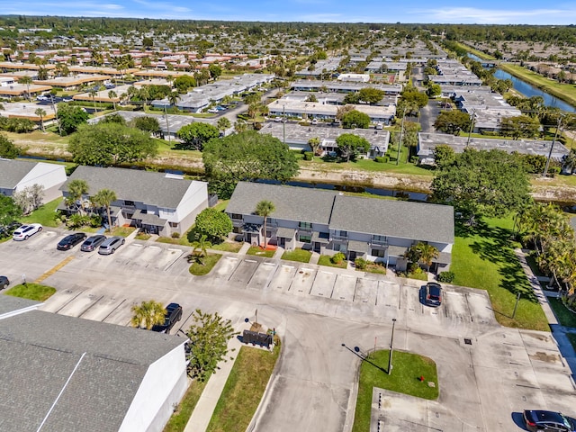 aerial view with a water view and a residential view