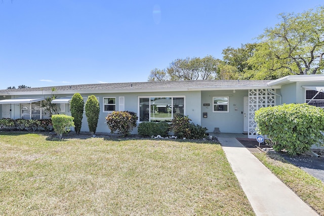 232 High Point Ct W Unit C, Delray Beach, FL 33445 - ranch-style home with a front yard and stucco siding