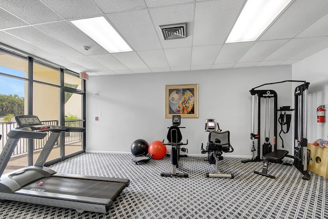2000 Presidential Way Unit 204, West Palm Beach, FL 33401 - exercise room with baseboards, floor to ceiling windows, carpet floors, visible vents, and a paneled ceiling