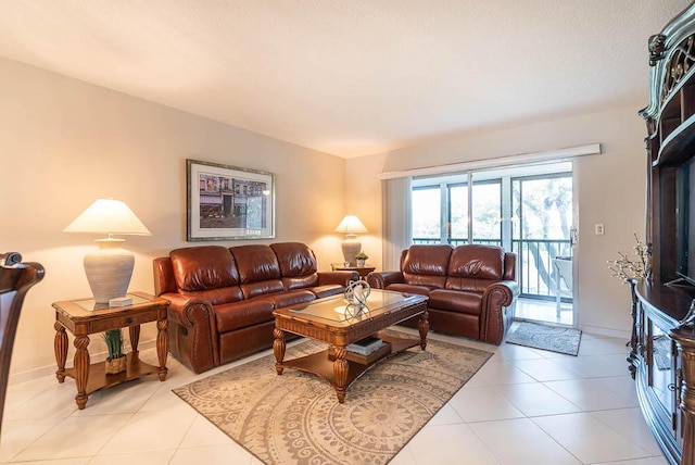 living area with light tile patterned flooring and baseboards