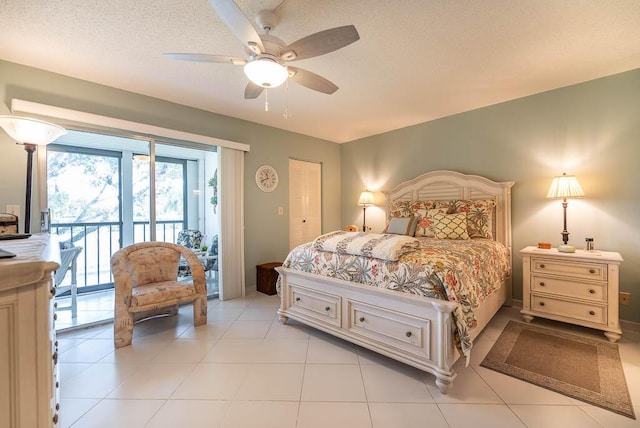 bedroom with light tile patterned flooring, access to exterior, ceiling fan, and a textured ceiling