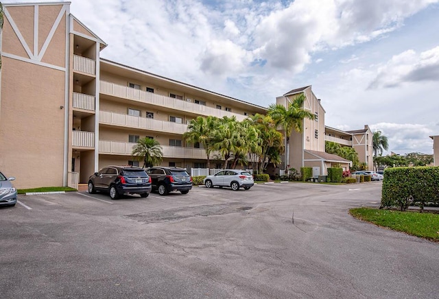 view of building exterior featuring uncovered parking
