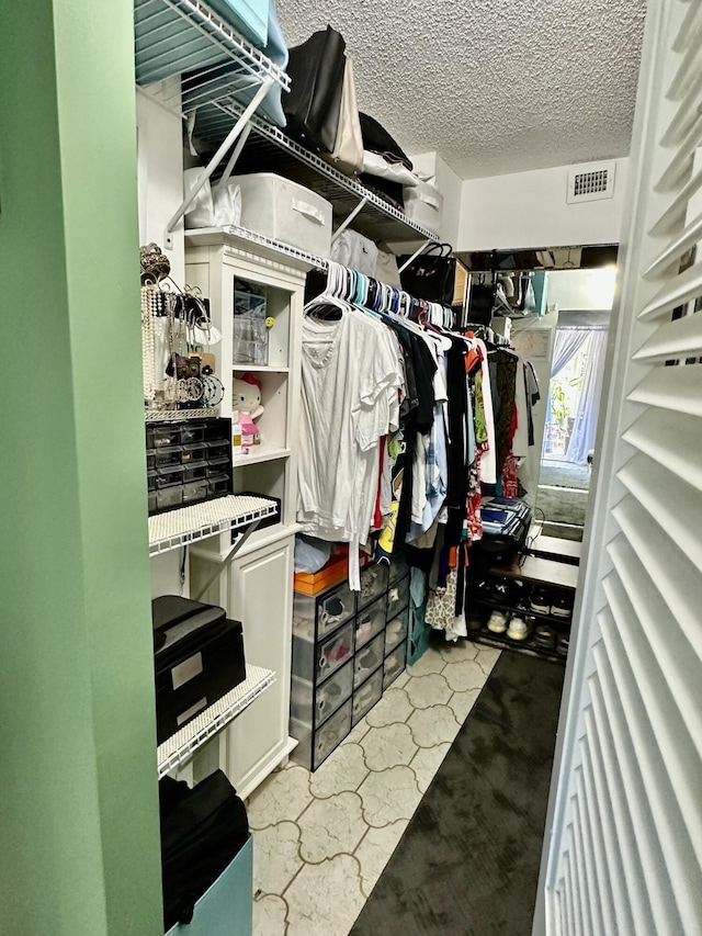 walk in closet featuring visible vents