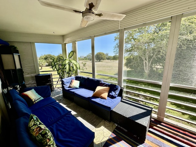 sunroom / solarium with an outdoor living space and ceiling fan