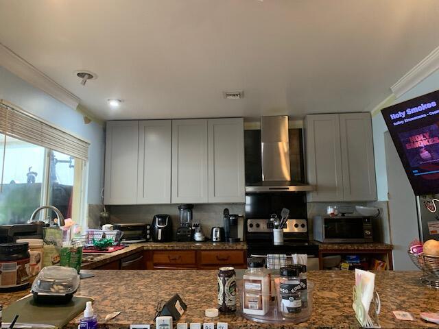 storage area featuring ceiling fan
