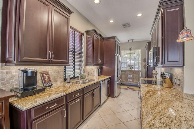 2036 SW Mayflower Dr, Palm City, FL 34990 - kitchen featuring a sink, appliances with stainless steel finishes, backsplash, decorative light fixtures, and recessed lighting