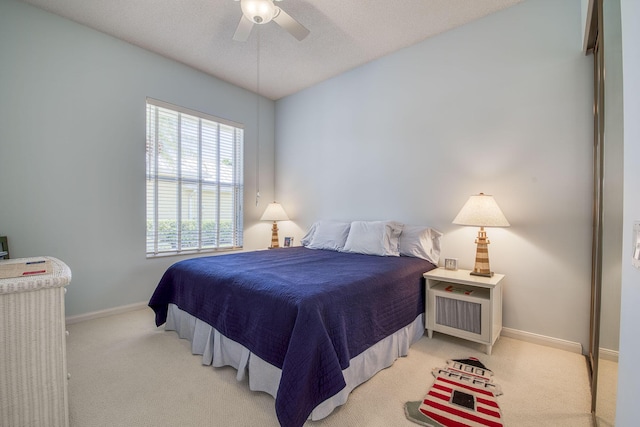 2036 SW Mayflower Dr, Palm City, FL 34990 - bedroom featuring light colored carpet, baseboards, and ceiling fan