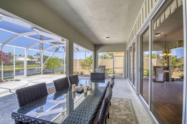 2036 SW Mayflower Dr, Palm City, FL 34990 - view of patio with a water view, area for grilling, and a lanai