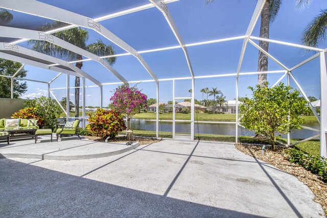 2036 SW Mayflower Dr, Palm City, FL 34990 - view of patio / terrace featuring a lanai and a water view