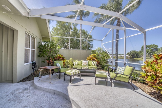2036 SW Mayflower Dr, Palm City, FL 34990 - view of patio / terrace with a water view, an outdoor living space, and glass enclosure