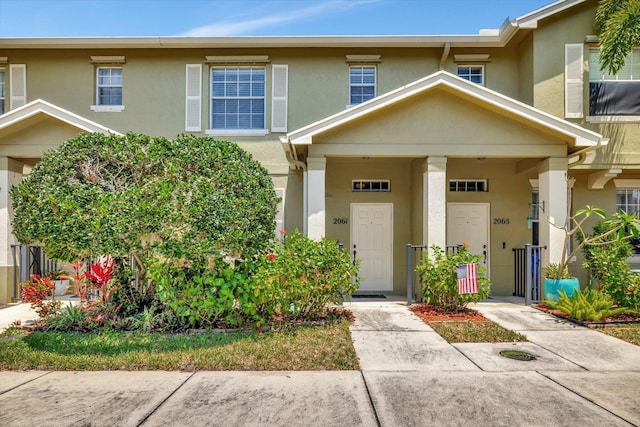2061 SE Glen Ridge Dr, Port Saint Lucie, FL 34952 - townhome / multi-family property with stucco siding