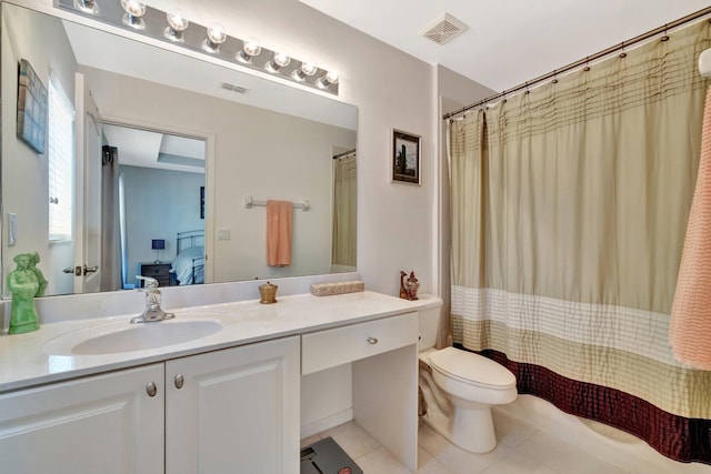 2061 SE Glen Ridge Dr, Port Saint Lucie, FL 34952 - full bathroom featuring tile patterned floors, vanity, toilet, visible vents, and ensuite bath