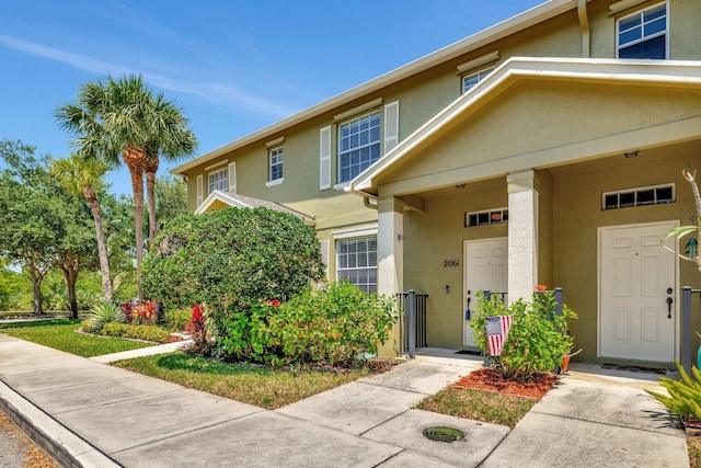 2061 SE Glen Ridge Dr, Port Saint Lucie, FL 34952 - view of front of house with stucco siding
