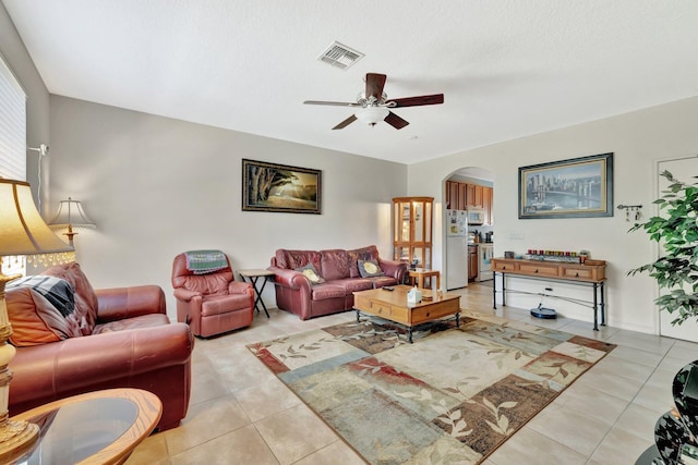 2061 SE Glen Ridge Dr, Port Saint Lucie, FL 34952 - living area with arched walkways, a ceiling fan, light tile patterned flooring, and visible vents