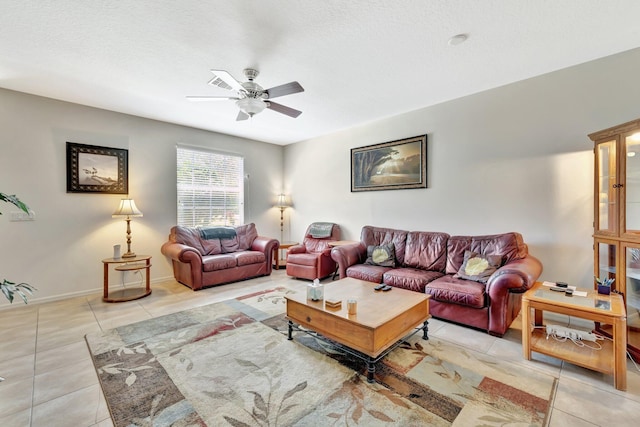 2061 SE Glen Ridge Dr, Port Saint Lucie, FL 34952 - living room with a ceiling fan, baseboards, and light tile patterned flooring