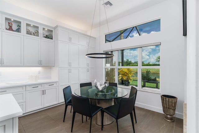9237 Seahorse Bay Dr, Boynton Beach, FL 33473 - dining room featuring baseboards and visible vents
