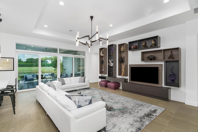 9237 Seahorse Bay Dr, Boynton Beach, FL 33473 - living room with recessed lighting, baseboards, a chandelier, a raised ceiling, and visible vents