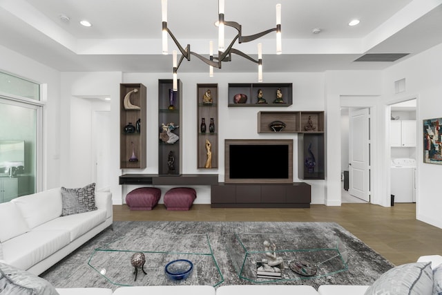 9237 Seahorse Bay Dr, Boynton Beach, FL 33473 - living area featuring a notable chandelier, a tray ceiling, recessed lighting, and washer / dryer