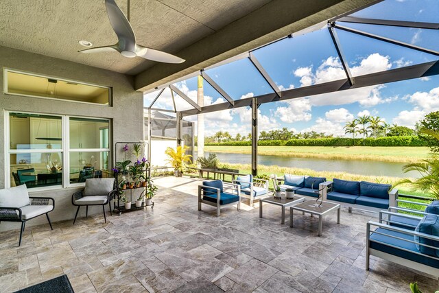 9237 Seahorse Bay Dr, Boynton Beach, FL 33473 - view of patio / terrace with outdoor lounge area, a lanai, a water view, and a ceiling fan