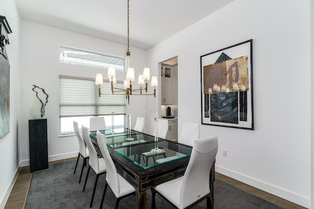 9237 Seahorse Bay Dr, Boynton Beach, FL 33473 - dining space with baseboards, an inviting chandelier, and dark wood-type flooring