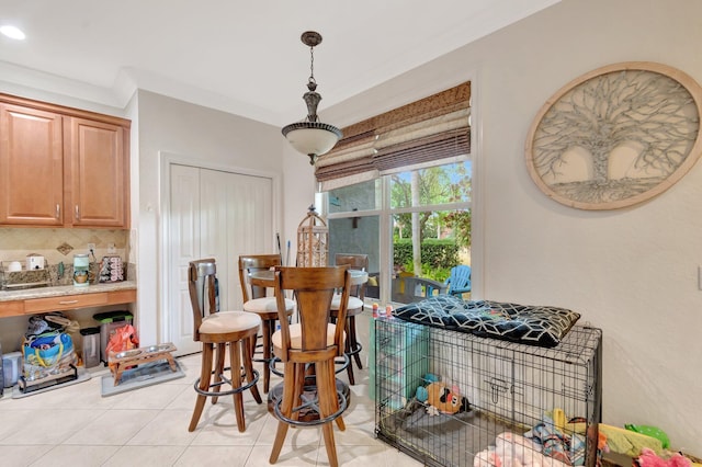 5541 Wishing Star Ln, Greenacres, FL 33463 - dining area featuring light tile patterned flooring and crown molding