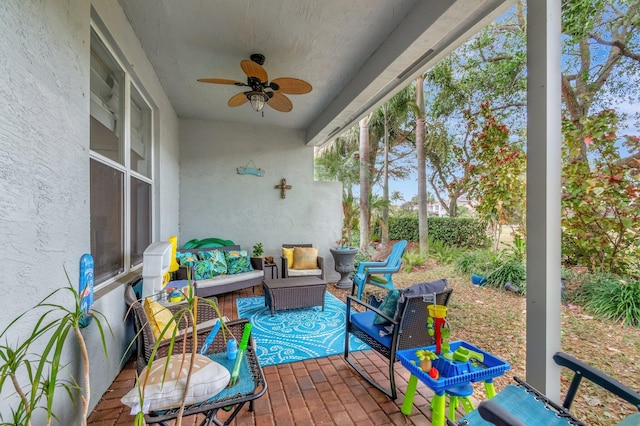 5541 Wishing Star Ln, Greenacres, FL 33463 - sunroom with a ceiling fan, a textured wall, brick floor, and an outdoor living space