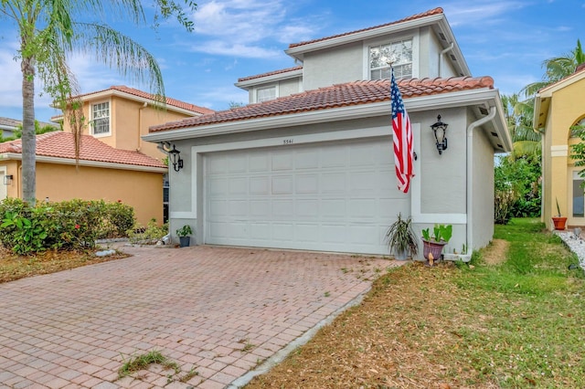 5541 Wishing Star Ln, Greenacres, FL 33463 - mediterranean / spanish-style house featuring a tile roof, decorative driveway, and stucco siding