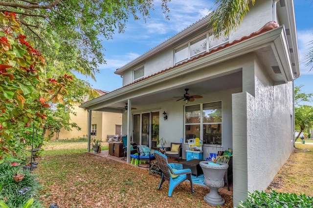 5541 Wishing Star Ln, Greenacres, FL 33463 - back of house featuring stucco siding and ceiling fan