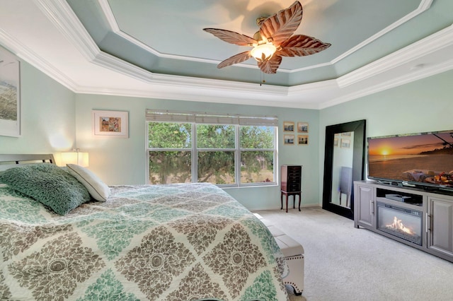 5541 Wishing Star Ln, Greenacres, FL 33463 - bedroom featuring a tray ceiling, ceiling fan, ornamental molding, and light carpet