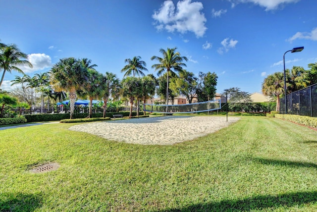 5541 Wishing Star Ln, Greenacres, FL 33463 - view of community with a yard, volleyball court, and fence