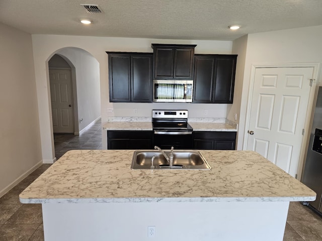 9213 Potomac Dr, Fort Pierce, FL 34945 - kitchen featuring light countertops, a sink, stainless steel appliances, and visible vents