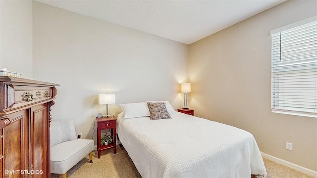 10577 SW Toren Way, Port Saint Lucie, FL 34987 - bedroom with light carpet and baseboards