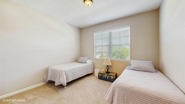 10577 SW Toren Way, Port Saint Lucie, FL 34987 - bedroom with light colored carpet and baseboards