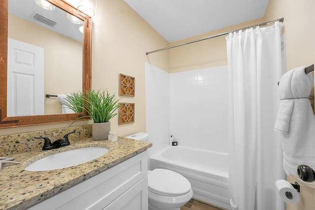 1701 SE Floresta Dr, Port Saint Lucie, FL 34983 - bathroom featuring toilet, vanity, and shower / tub combo