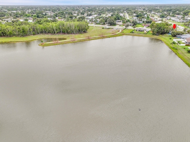 1701 SE Floresta Dr, Port Saint Lucie, FL 34983 - aerial view of residential area featuring a large body of water and a tree filled landscape