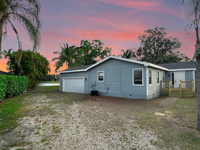 1701 SE Floresta Dr, Port Saint Lucie, FL 34983 - view of side of home featuring crawl space and driveway