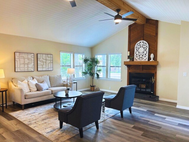 1701 SE Floresta Dr, Port Saint Lucie, FL 34983 - living area featuring a ceiling fan, dark wood-style floors, baseboards, and a large fireplace