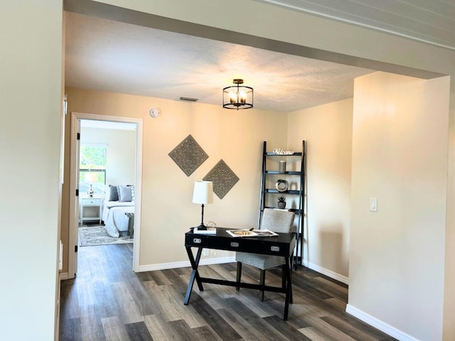 1701 SE Floresta Dr, Port Saint Lucie, FL 34983 - home office with dark wood finished floors, baseboards, and a chandelier