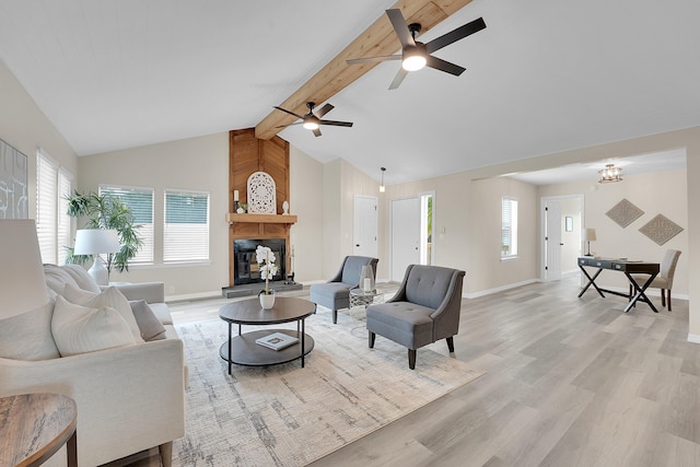 1701 SE Floresta Dr, Port Saint Lucie, FL 34983 - living area with light wood-type flooring, beam ceiling, a large fireplace, baseboards, and healthy amount of natural light
