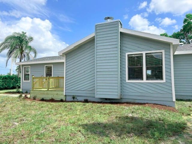 1701 SE Floresta Dr, Port Saint Lucie, FL 34983 - view of side of property with a lawn