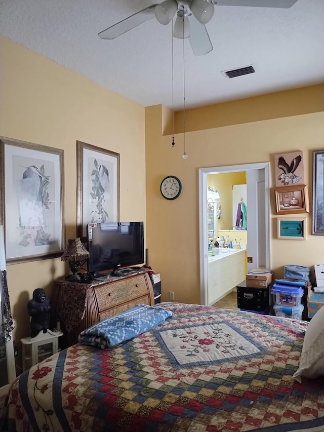 1047 NW Tuscany Dr, Port Saint Lucie, FL 34986 - bedroom with visible vents, ensuite bathroom, and a ceiling fan