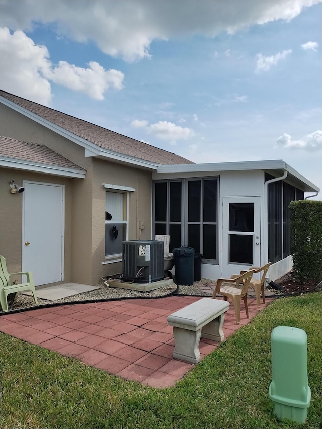 1047 NW Tuscany Dr, Port Saint Lucie, FL 34986 - back of house with cooling unit, stucco siding, a shingled roof, and a patio area